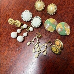 7 pair of clip on earrings/ milk glass , enamel